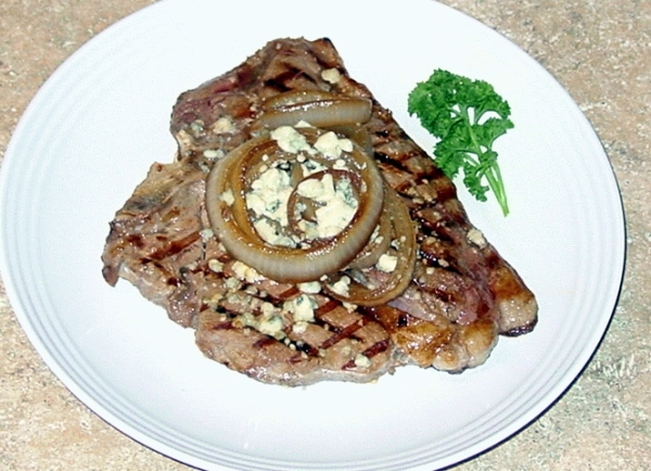 Finished Steak with carmelized onion rings and Blue cheese