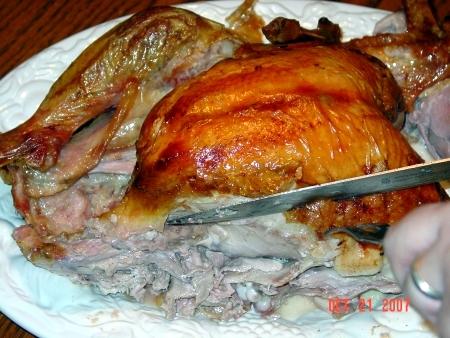 Stabilize the turkey with your fork