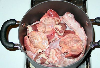 Three sets of giblets in the pot.