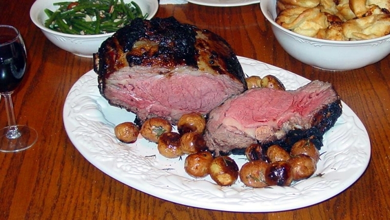 Prime Rib with roasted rosemary red potatoes, green beans almondine, Yorkshire pudding, and a nice Cabernet