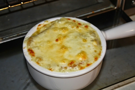 French Onion Soup in Crock with lightly browned cheese